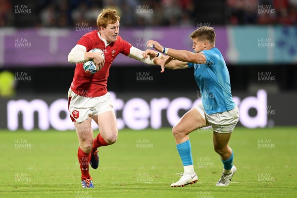 131019 - Wales v Uruguay - Rugby World Cup - Pool D - Rhys Patchell of Wales is tackled by Leandro Leivas of Uruguay