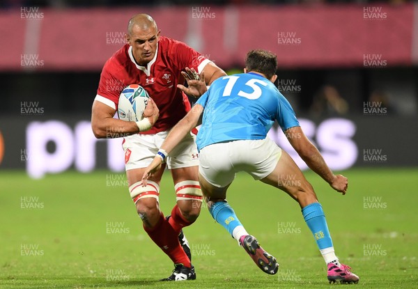 131019 - Wales v Uruguay - Rugby World Cup - Pool D - Aaron Shingler of Wales is tackled by Gaston Mieres of Uruguay