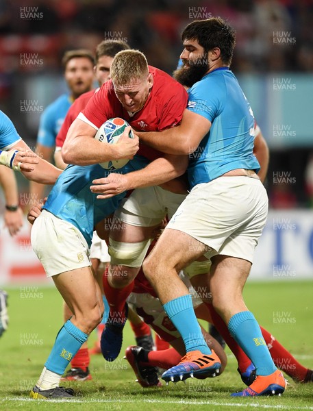 131019 - Wales v Uruguay - Rugby World Cup - Pool D - Bradley Davies of Wales is tackled just before the try line by Santiago Arata and Diego Arbelo of Uruguay