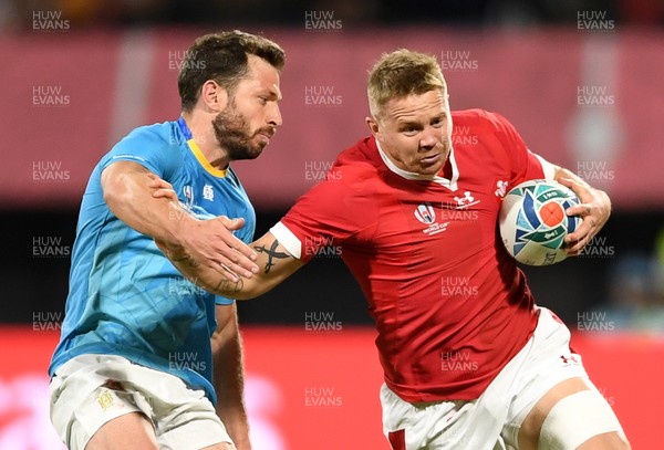 131019 - Wales v Uruguay - Rugby World Cup - Pool D - James Davies of Wales is tackled by Felipe Berchesi of Uruguay