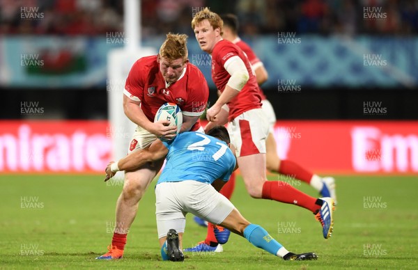 131019 - Wales v Uruguay - Rugby World Cup - Pool D - Rhys Carre of Wales is tackled by Agustin Ormaechea of Uruguay