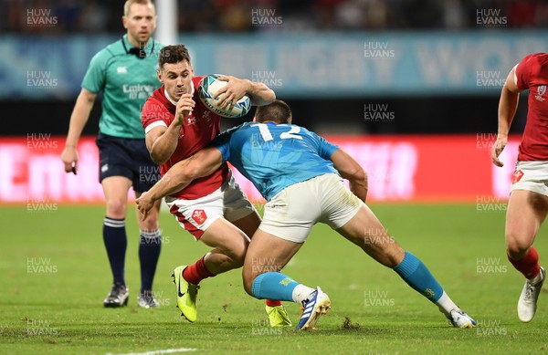 131019 - Wales v Uruguay - Rugby World Cup - Pool D - Tomos Williams of Wales is tackled by Andres Vilaseca of Uruguay