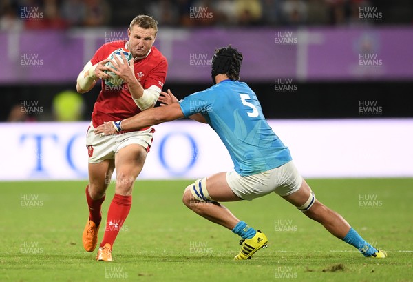 131019 - Wales v Uruguay - Rugby World Cup - Pool D - Hadleigh Parkes of Wales is tackled by Manuel Leindekar of Uruguay