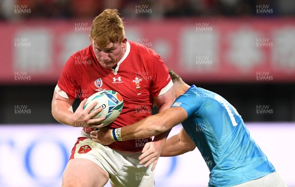 131019 - Wales v Uruguay - Rugby World Cup - Pool D - Rhys Carre of Wales is tackled by Leandro Leivas of Uruguay