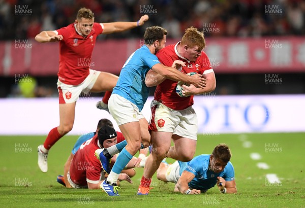 131019 - Wales v Uruguay - Rugby World Cup - Pool D - Rhys Carre of Wales is tackled by Felipe Berchesi and Leandro Leivas of Uruguay