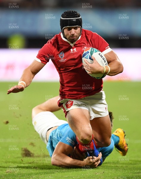 131019 - Wales v Uruguay - Rugby World Cup - Pool D - Leigh Halfpenny of Wales is tackled by Felipe Berchesi of Uruguay