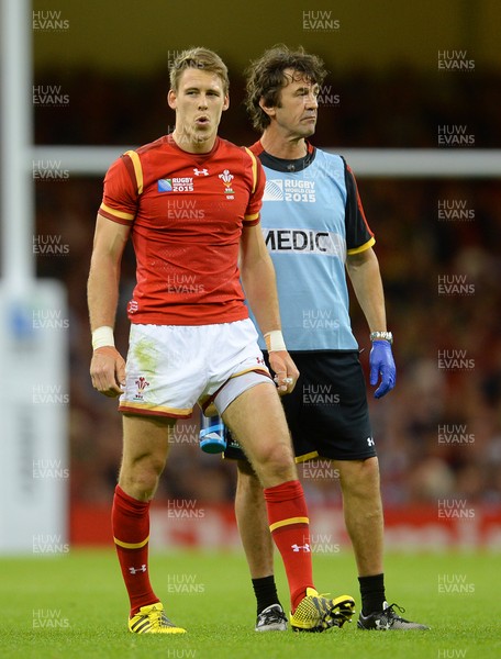 200915 - Wales v Uruguay - Rugby World Cup 2015 -Liam Williams of Wales leaves the field with physio Mark Davies