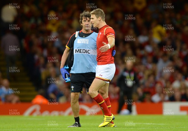 200915 - Wales v Uruguay - Rugby World Cup 2015 -Liam Williams of Wales leaves the field with physio Mark Davies