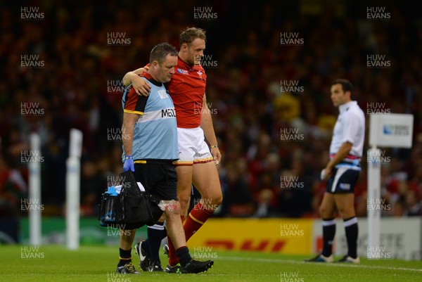 200915 - Wales v Uruguay - Rugby World Cup 2015 -Cory Allen of Wales leaves the field with team doctor Geoff Davies