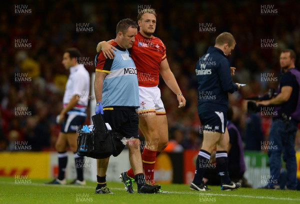 200915 - Wales v Uruguay - Rugby World Cup 2015 -Cory Allen of Wales leaves the field with team doctor Geoff Davies