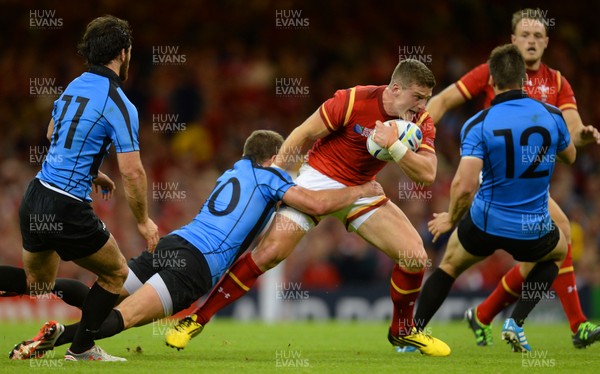 200915 - Wales v Uruguay - Rugby World Cup 2015 -Scott Williams of Wales is tackled by Felipe Berchesi of Uruguay