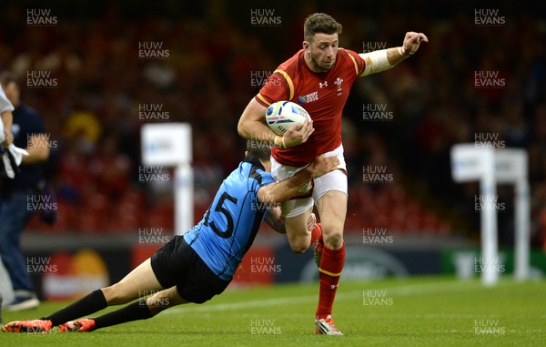 200915 - Wales v Uruguay - Rugby World Cup 2015 -Alex Cuthbert of Wales is tackle by Gaston Mieres of Uruguay