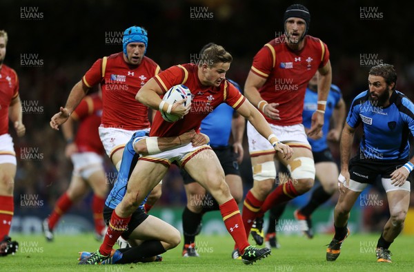 200915 - Wales v Uruguay - Rugby World Cup 2015 - Hallam Amos of Wales is tackled by Agustin Ormaechea of Uruguay