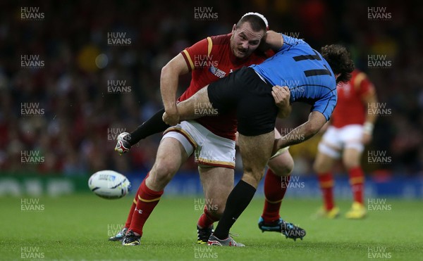 200915 - Wales v Uruguay - Rugby World Cup 2015 - Ken Owens of Wales tackles Rodrigo Silva of Uruguay