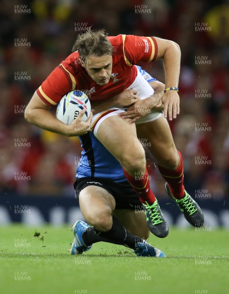 200915 - Wales v Uruguay, Rugby World Cup 2015 - Cory Allen of Wales is tackled by Andres Vilaseca of Uruguay