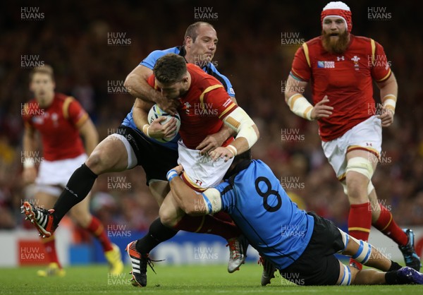 200915 - Wales v Uruguay, Rugby World Cup 2015 - Alex Cuthbert of Wales is tackled by Alejo Corral of Uruguay and Alejandro Nieto of Uruguay