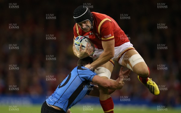 200915 - Wales v Uruguay, Rugby World Cup 2015 - James King of Wales is tackled by Felipe Berchesi of Uruguay