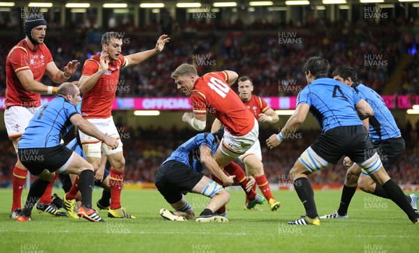 200915 - Wales v Uruguay, Rugby World Cup 2015 - Rhys Priestland of Wales is tackled by Matias Beer of Uruguay