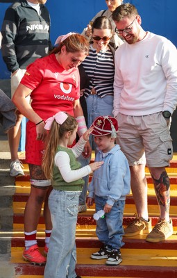 260926 Wales v USA, Vodafone Wales WXV Series - Georgia Evans of Wales with niece Ella-May and nephew Noah and her 50 cap at the end of the match