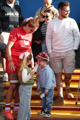 260926 Wales v USA, Vodafone Wales WXV Series - Georgia Evans of Wales with niece Ella-May and nephew Noah and her 50 cap at the end of the match