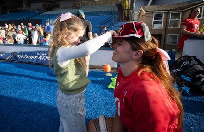 260926 Wales v USA, Vodafone Wales WXV Series - Georgia Evans of Wales with niece Ella-May and her 50 cap at the end of the match