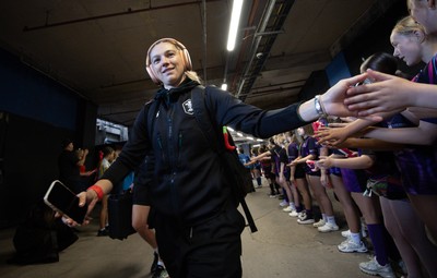 260926 Wales v USA, Vodafone Wales WXV Series - Keira Bevan of Wales is greeted by fans as she walks to the stadium