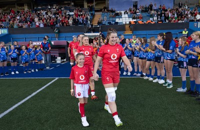 260926 Wales v USA, Vodafone Wales WXV Series - Wales co-captain Kate Williams walks out with the match mascot