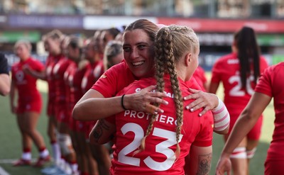 260926 Wales v USA, Vodafone Wales WXV Series - Georgia Evans of Wales greets her team mates as they walk out at the start of the match