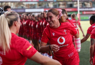 260926 Wales v USA, Vodafone Wales WXV Series - Georgia Evans of Wales greets her team mates as they walk out at the start of the match