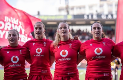 260926 Wales v USA, Vodafone Wales WXV Series - Molly Reardon of Wales, Lisa Neumann of Wales, Carys Cox of Wales and Courtney Keight of Wales during the anthems