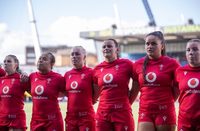 260926 Wales v USA, Vodafone Wales WXV Series - Keira Bevan of Wales, Jenna De Vera of Wales, Nikita Prothero of Wales, Branwen Metcalfe of Wales, Jorja Aiono of Wales, and Elan Jones of Wales during the anthems