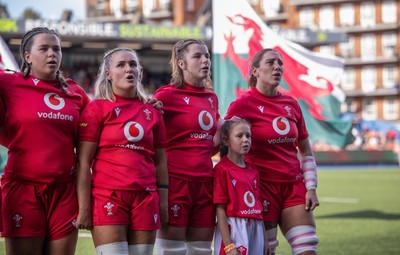 260926 Wales v USA, Vodafone Wales WXV Series - Maisie Davies of Wales, Alex Callender of Wales, Kate Williams of Wales and Georgia Evans of Wales with the match mascot during the anthems