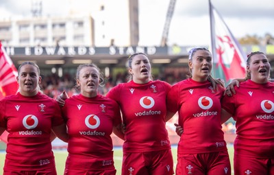 260926 Wales v USA, Vodafone Wales WXV Series - Freya Bell of Wales, Lleucu George of Wales, Gwen Crabb of Wales, Bryonie King of Wales, Gwenllian Pyrs of Wales, Maisie Davies of Wales during the anthems