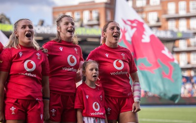 260926 Wales v USA, Vodafone Wales WXV Series - Alex Callender of Wales, Kate Williams of Wales and Georgia Evans of Wales with the match mascot during the anthems