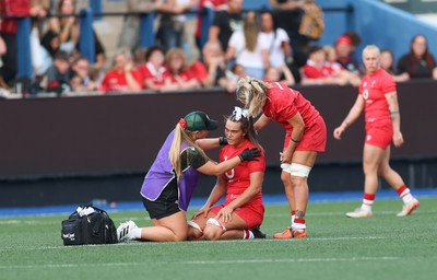 260926 Wales v USA, Vodafone Wales WXV Series - Bryonie King of Wales is treated by Erin Lynch, Wales National Squad Physio