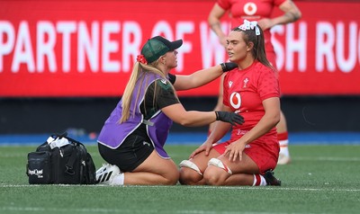 260926 Wales v USA, Vodafone Wales WXV Series - Bryonie King of Wales is treated by Erin Lynch, Wales National Squad Physio