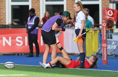260926 Wales v USA, Vodafone Wales WXV Series - Keira Bevan of Wales is treated by Gwennan Williams, Team Doctor