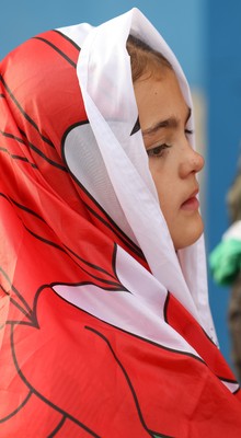 260926 Wales v USA, Vodafone Wales WXV Series - Young Wales fan wrapped in a Wales flag