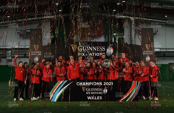 270321 - Picture shows the Wales team lifting the Guinness 6 Nations Championship trophy along with the Triple Crown after being crowned champions last night