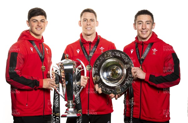 270321 - Wales Rugby Team Presented with Guinness Six Nations Trophy -  Louis Rees-Zammit, Liam Williams and Josh Adams with the trophy and triple crown