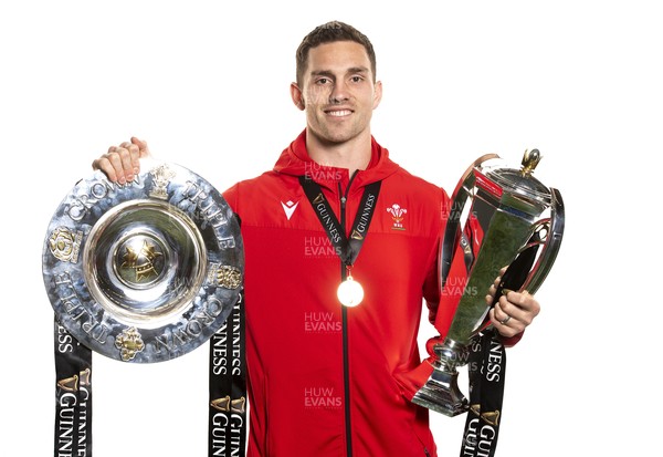 270321 - Wales Rugby Team Presented with Guinness Six Nations Trophy -  George North with the trophy and triple crown