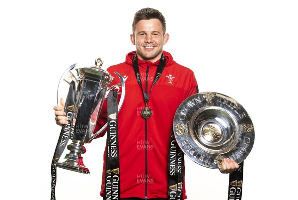 270321 - Wales Rugby Team Presented with Guinness Six Nations Trophy -  Elliot Dee with the trophy and triple crown