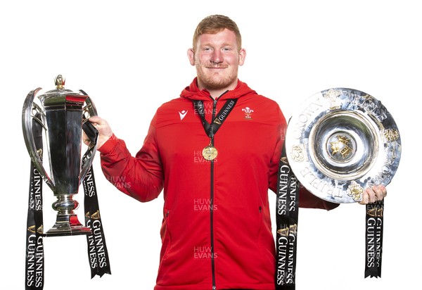 270321 - Wales Rugby Team Presented with Guinness Six Nations Trophy -  Rhys Carre with the trophy and triple crown