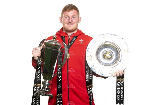 270321 - Wales Rugby Team Presented with Guinness Six Nations Trophy -  Rhys Carre with the trophy and triple crown