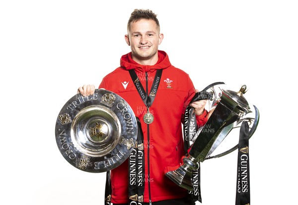 270321 - Wales Rugby Team Presented with Guinness Six Nations Trophy -  Hallam Amos with the trophy and triple crown