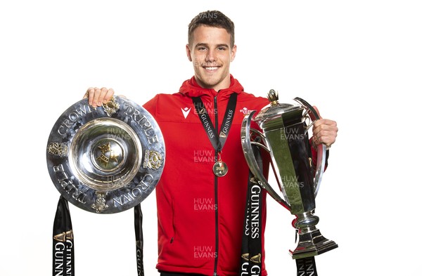 270321 - Wales Rugby Team Presented with Guinness Six Nations Trophy -  Kieran Hardy with the trophy and triple crown