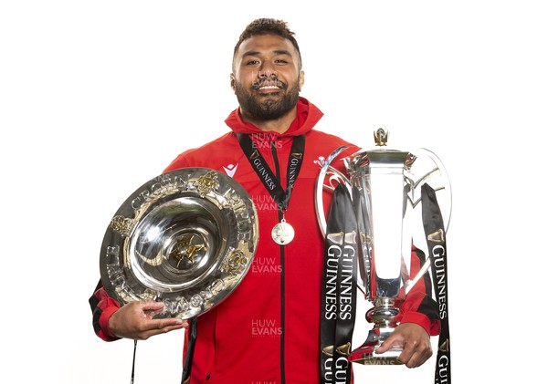 270321 - Wales Rugby Team Presented with Guinness Six Nations Trophy -  Willis Halaholo with the trophy and triple crown