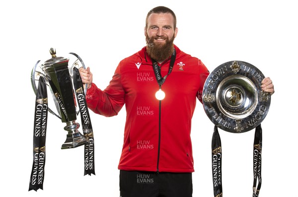 270321 - Wales Rugby Team Presented with Guinness Six Nations Trophy -  Jake Ball with the trophy and triple crown