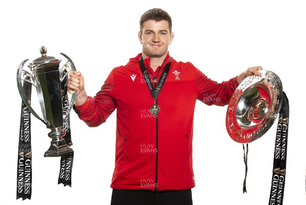 270321 - Wales Rugby Team Presented with Guinness Six Nations Trophy -  Rhodri Jones with the trophy and triple crown