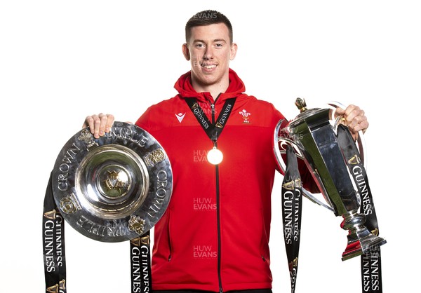 270321 - Wales Rugby Team Presented with Guinness Six Nations Trophy -  Adam Beard with the trophy and triple crown